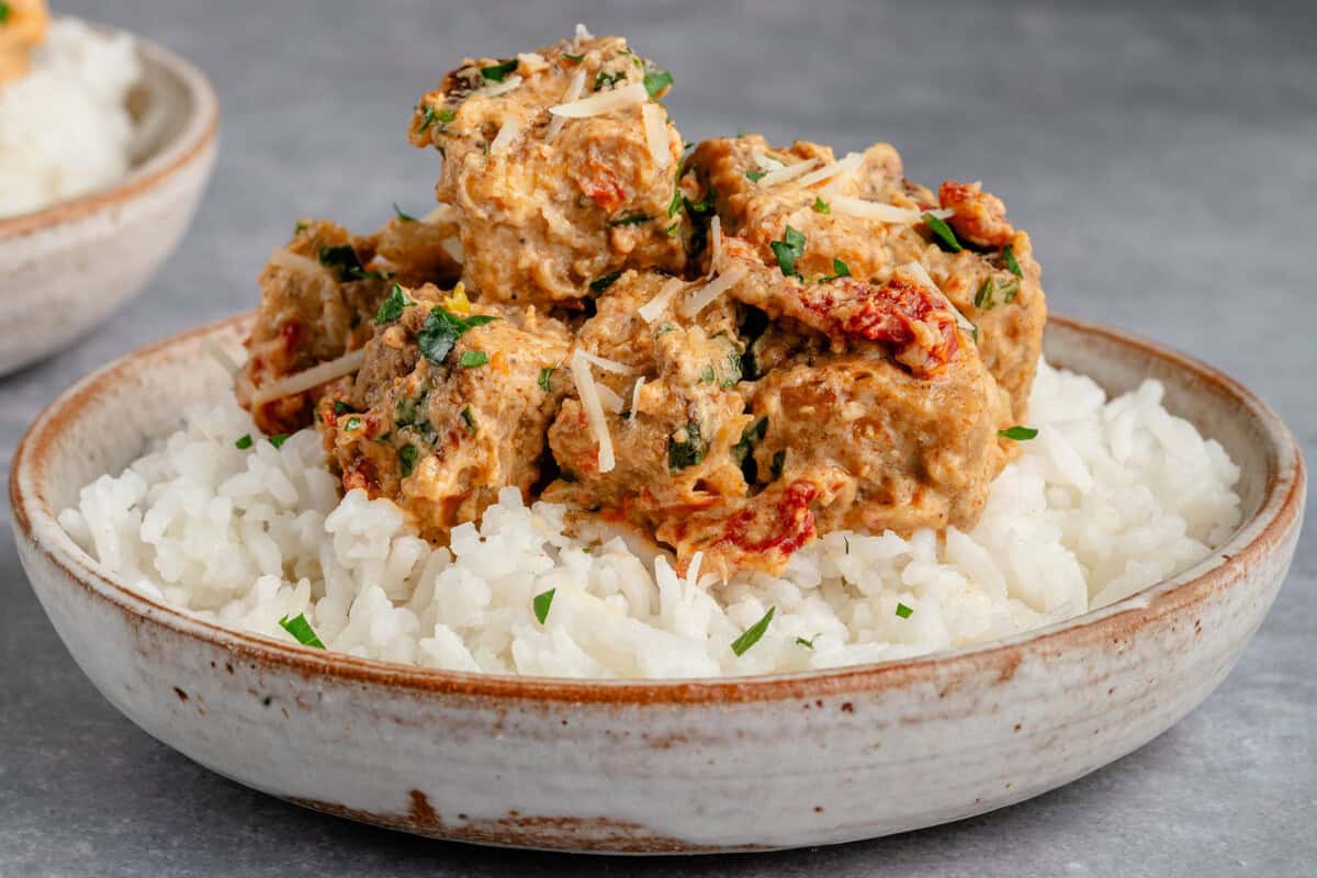 marry me tofu served over rice topped with parm and fresh herbs