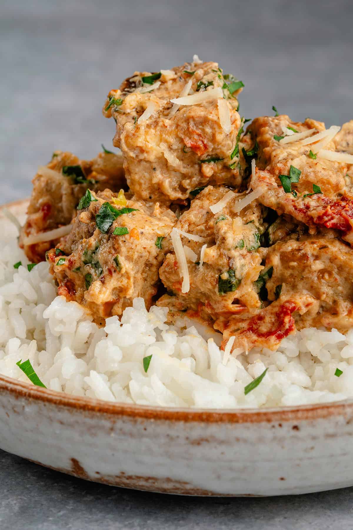 marry me tofu served over rice topped with parm and fresh herbs