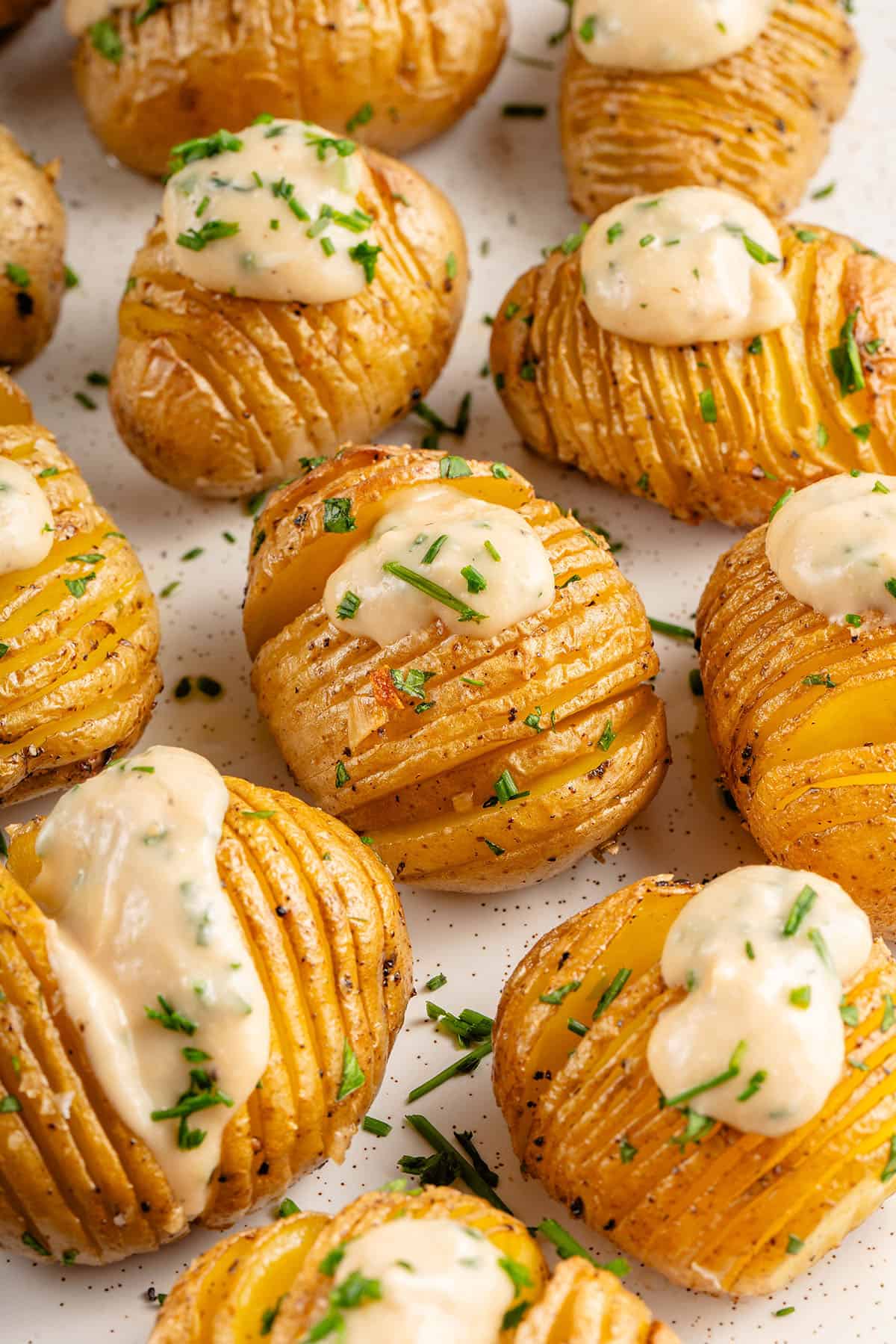 mini vegan sour cream and onion hasselback potatoes on tray