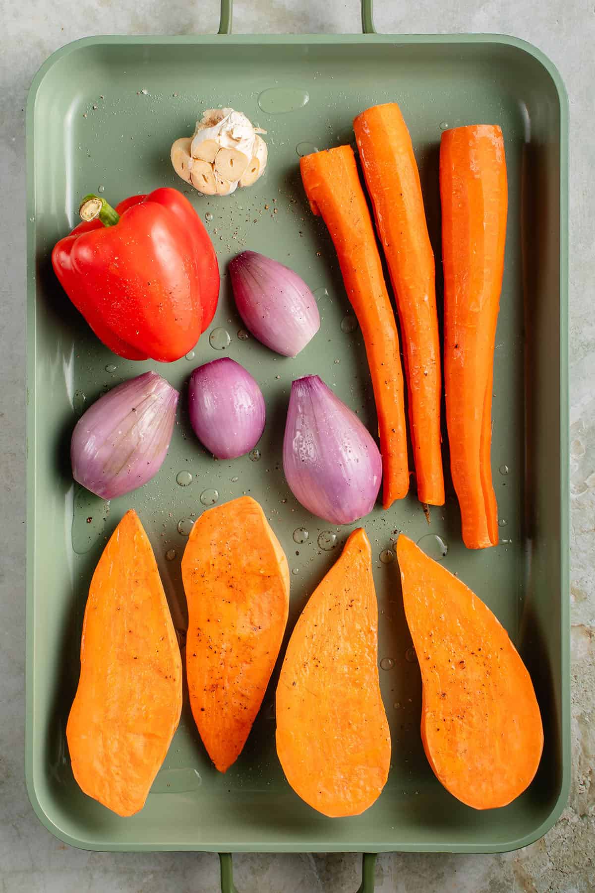 veggies on a baking sheet before being roasted