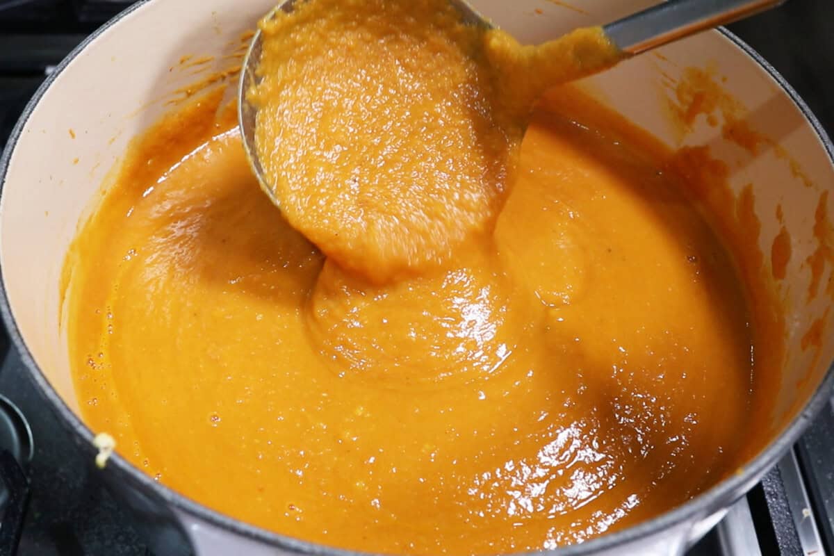 mixing sweet potato soup