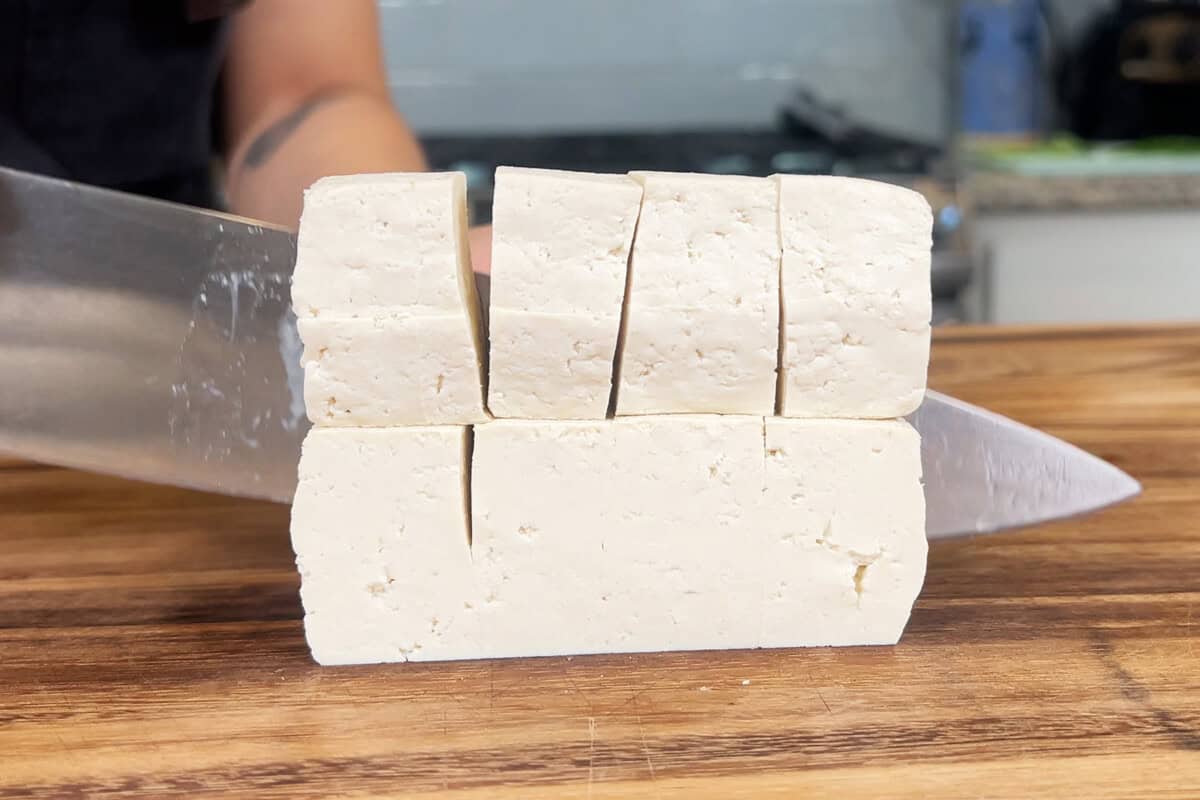 slicing tofu into cubes