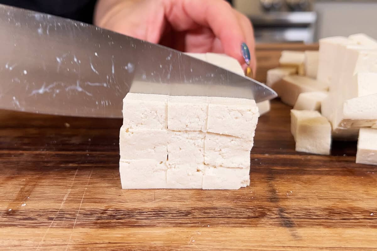 slicing tofu into cubes