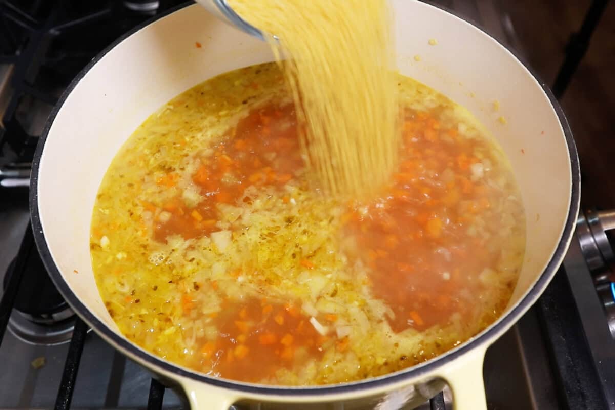 adding pasta to soup