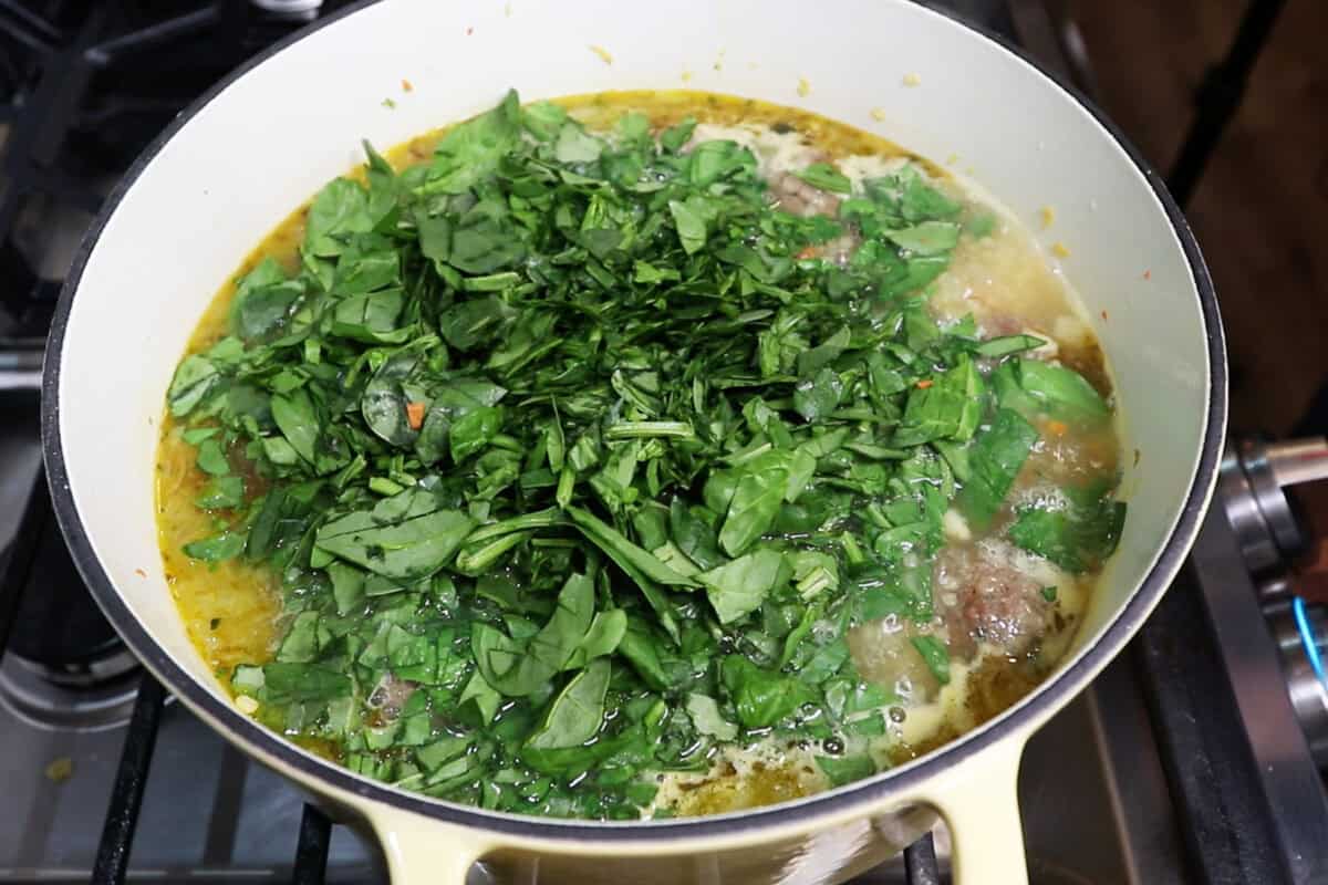 adding spinach to soup