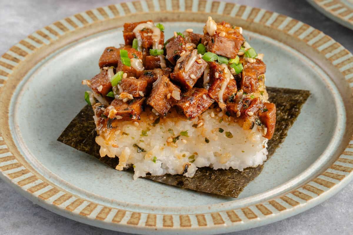 slice of tofu musubi bake on a sheet of nori