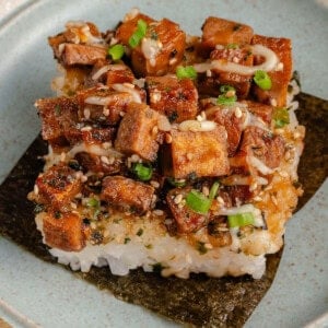 slice of tofu musubi bake on a sheet of nori