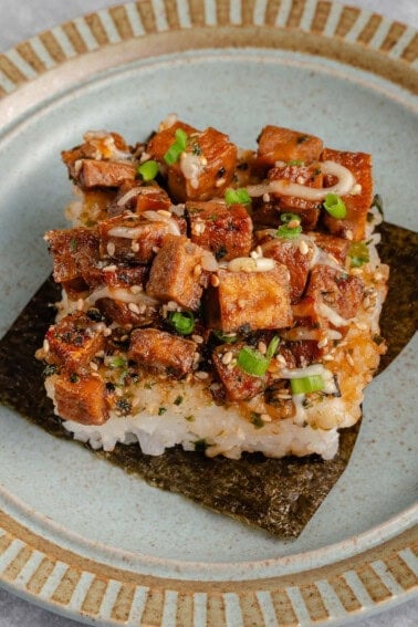 slice of tofu musubi bake on a sheet of nori