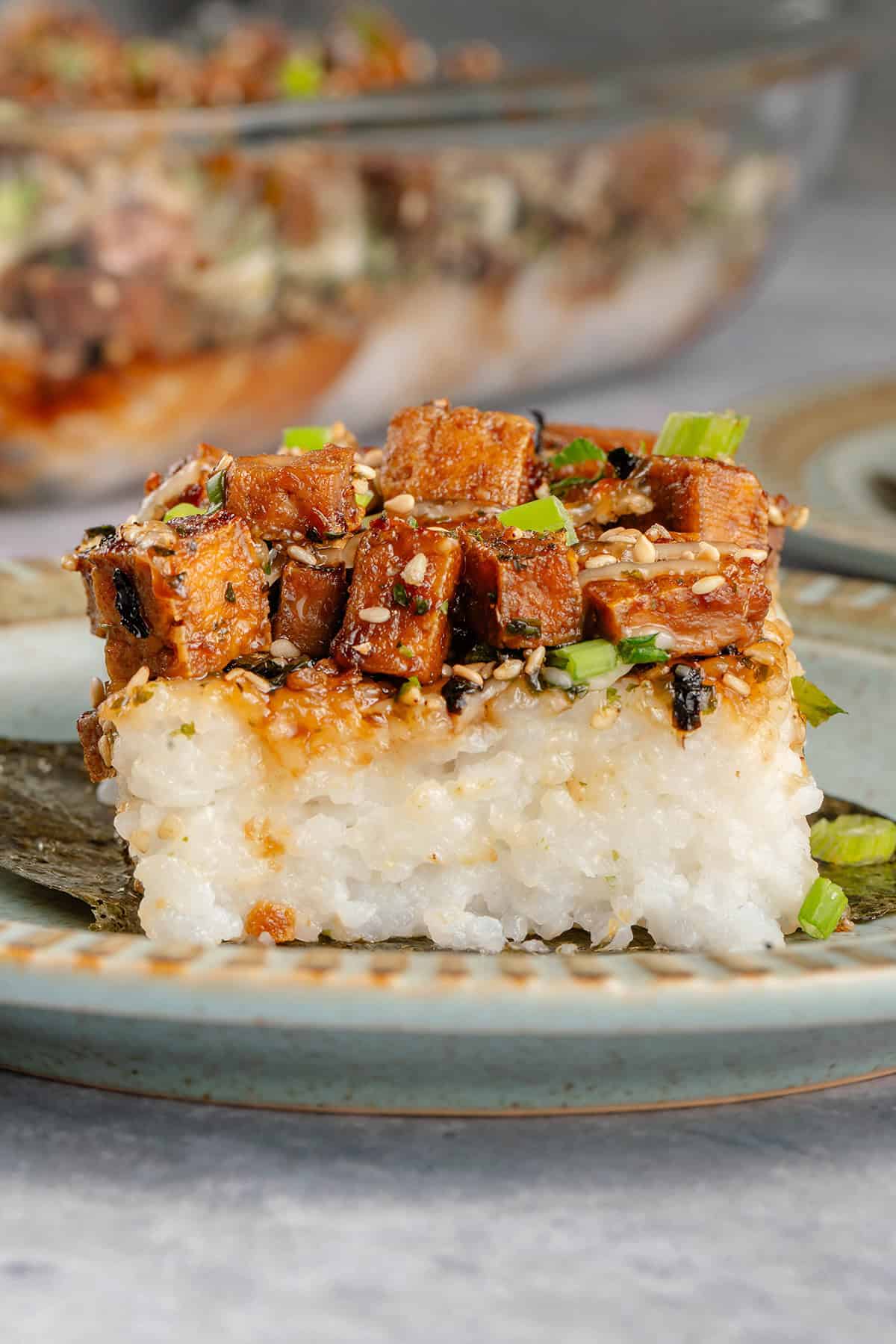 slice of tofu musubi bake on a sheet of nori