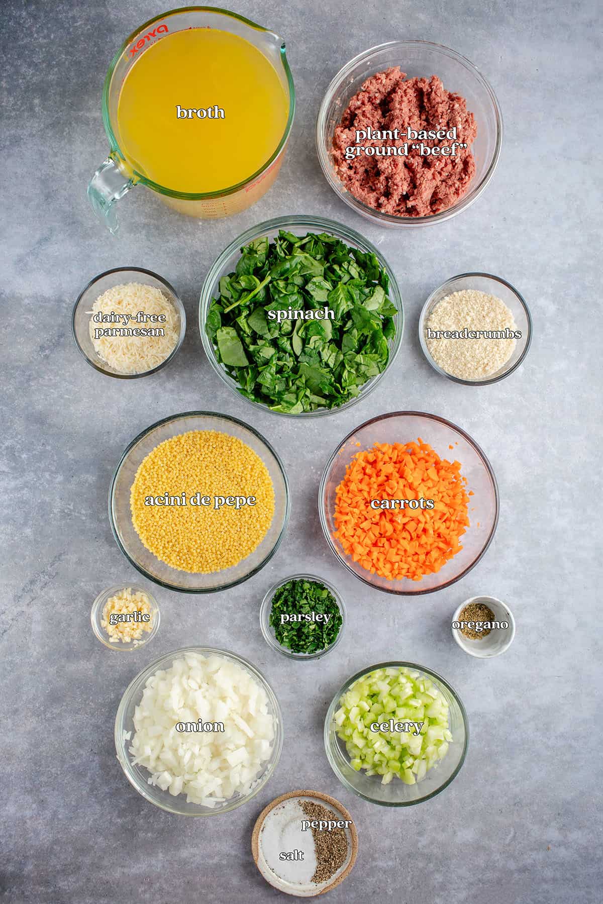 broth, plant-based ground beef, dairy-free parmesan, spinach, breadcrumbs, acini de pepe, carrots, garlic, parsley, oregano, onion, celery, salt, pepper