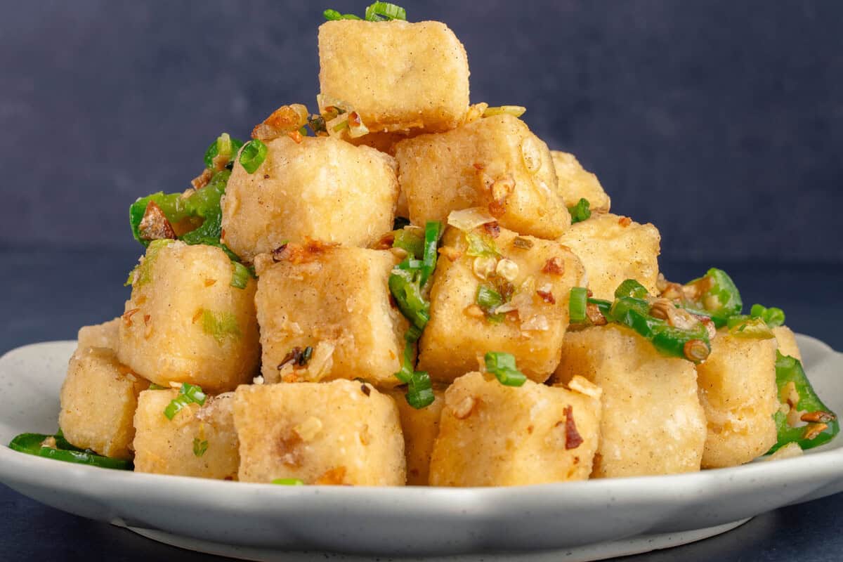 close up of crispy salt and pepper tofu piled high