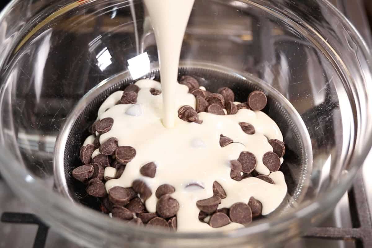 adding in dairy-free heavy cream to the chocolate chips