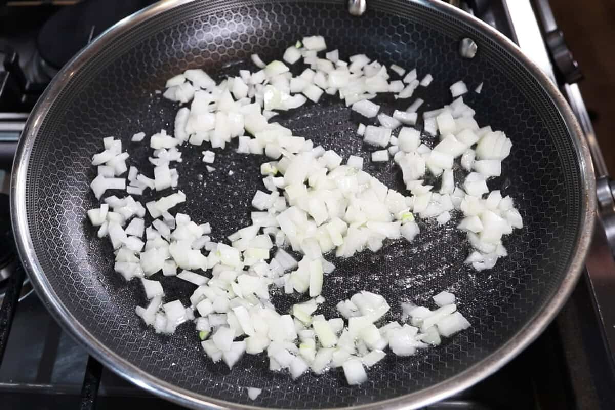 cooking onions in a skillet