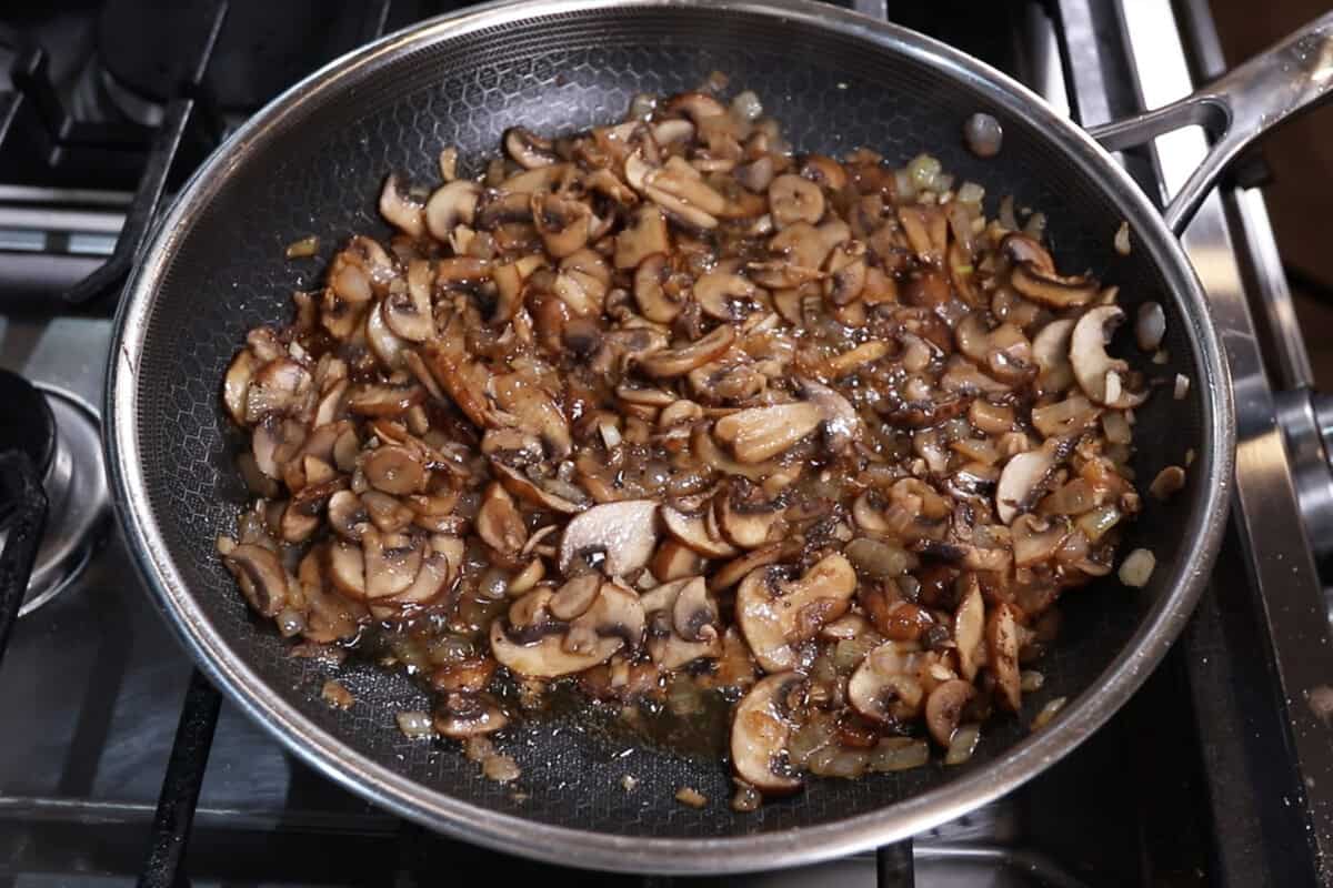 cooking mushroom gravy in pan