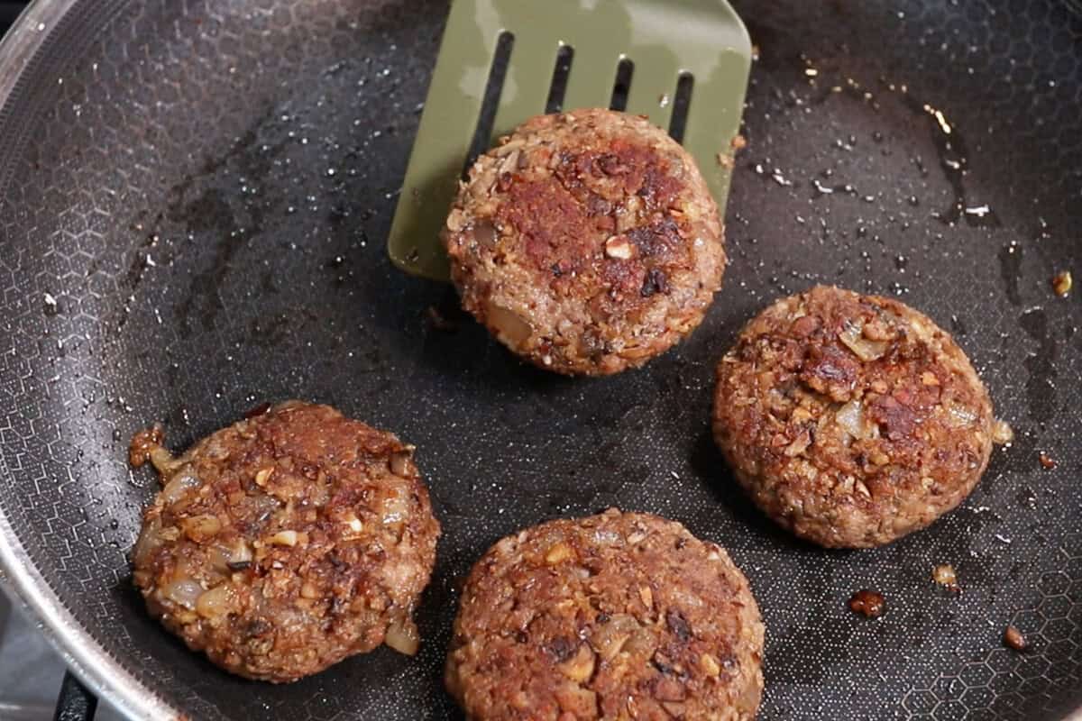 cooked burger steak patties in pan