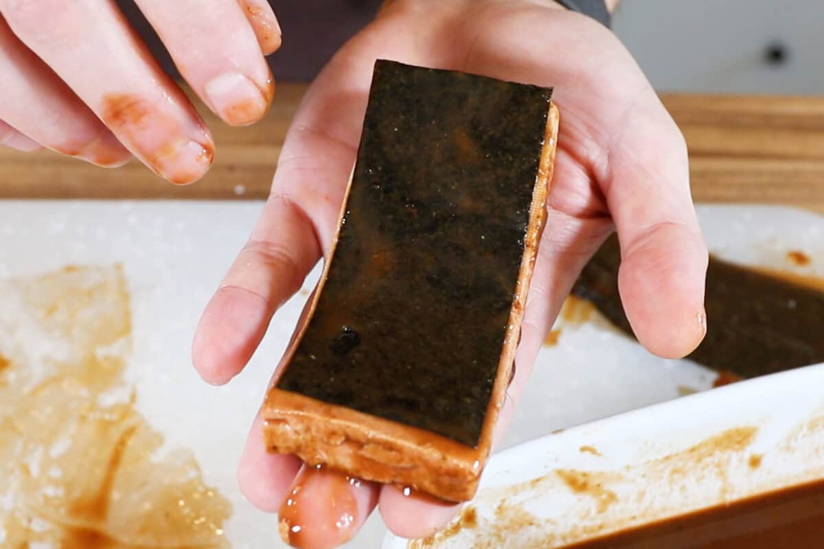 adding nori sheet to marinated tofu