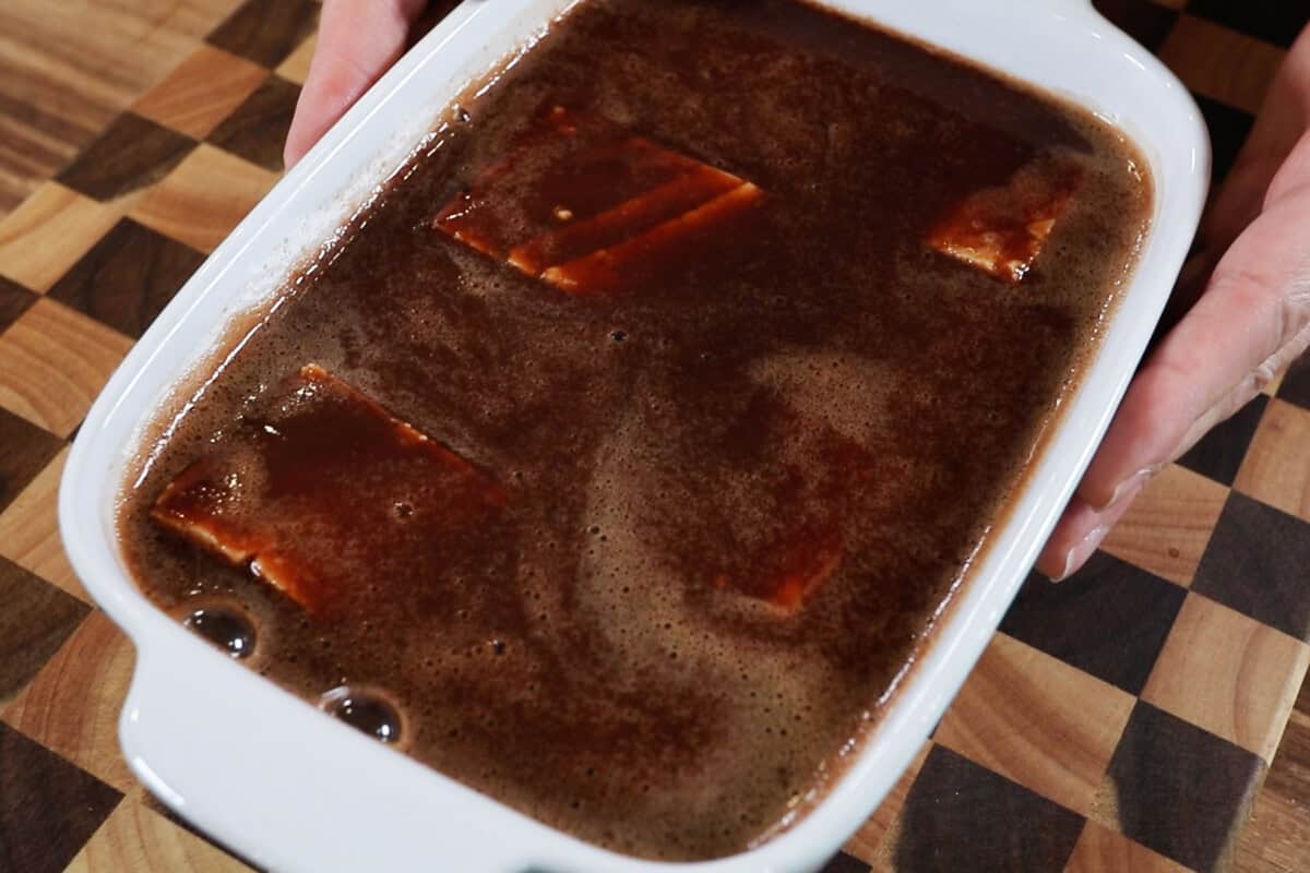 marinating tofu in a deep baking dish