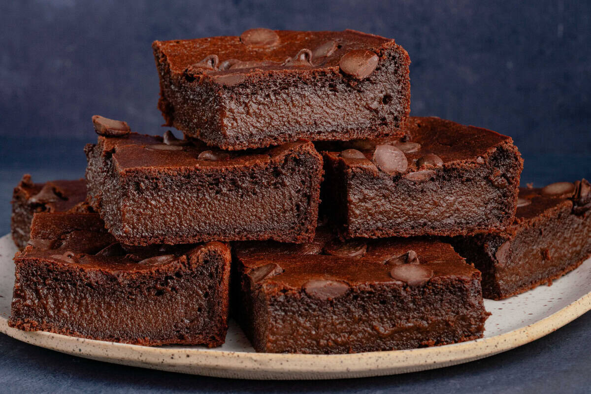 vegan mochi brownies cut into squares on a plate