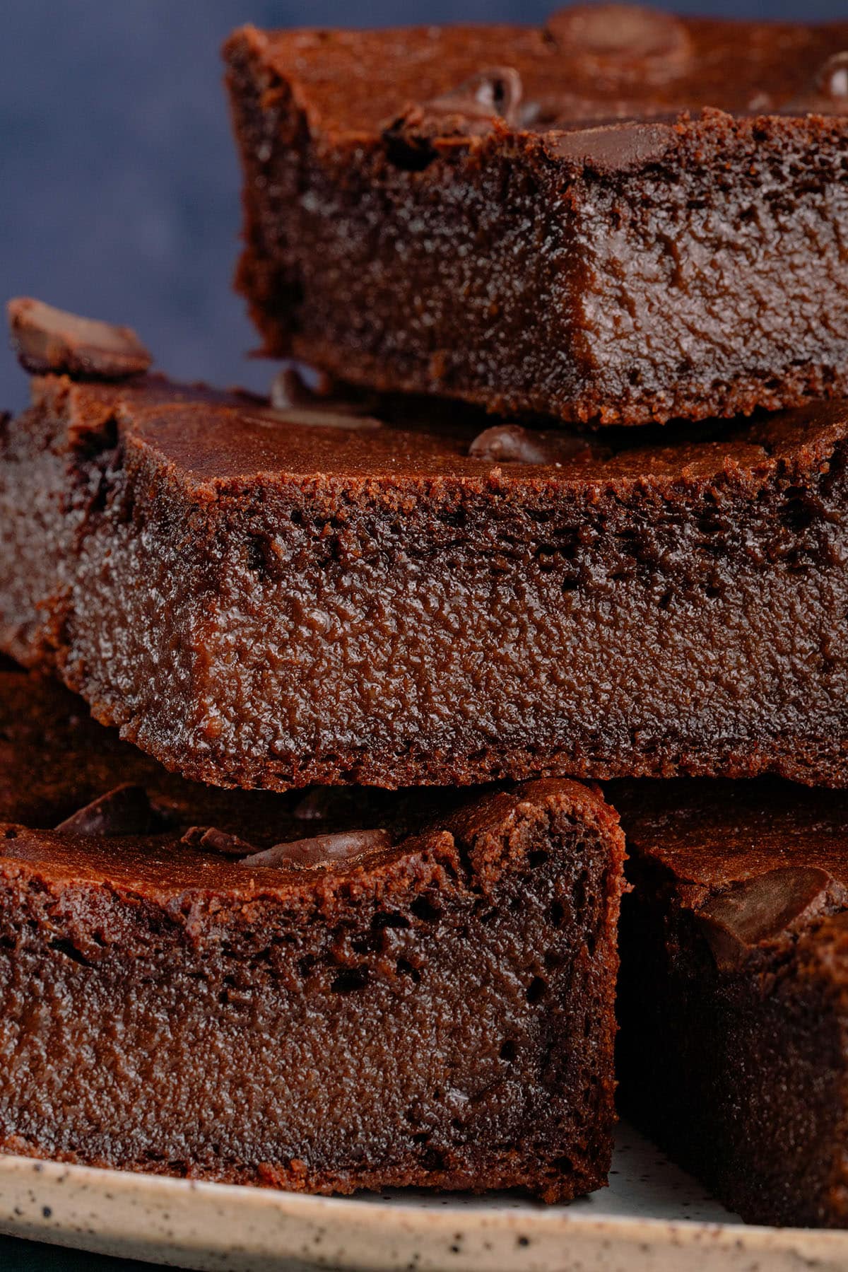 vegan mochi brownies cut into squares on a plate