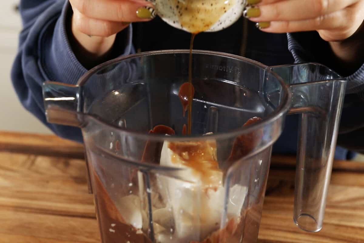 adding ingredients to a blender