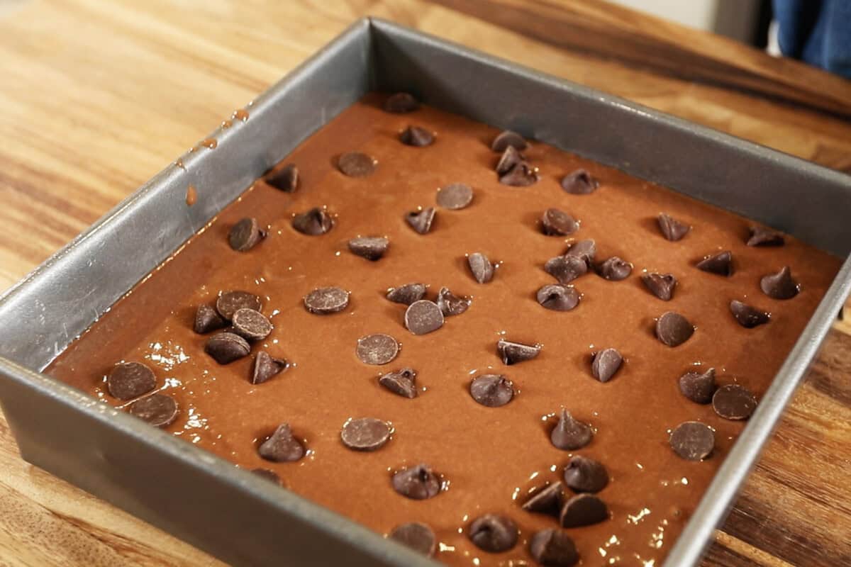 chocolate chips added onto the brownie batter