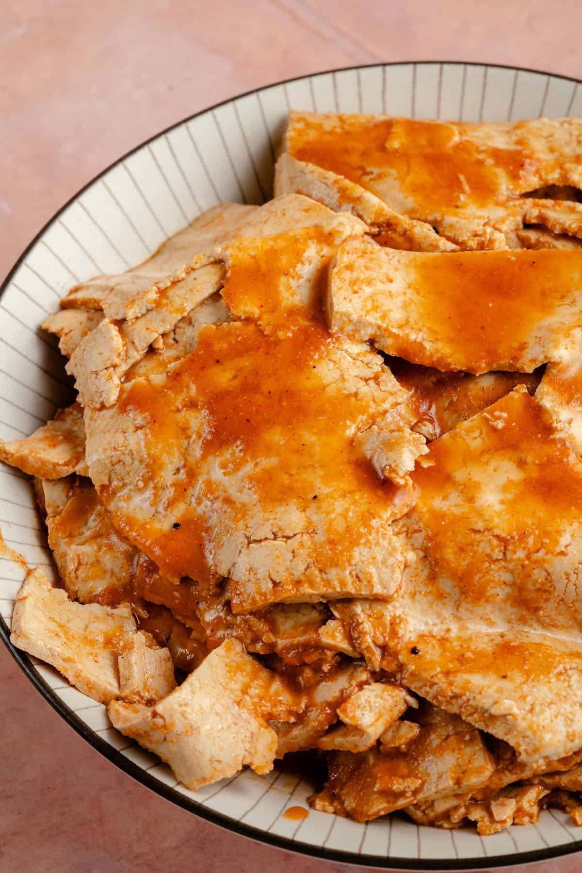 photo of Ham-Style Tofu Deli Meat Slices in white striped bowl