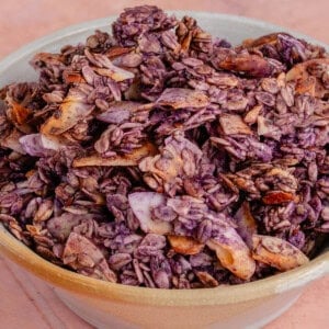 Bowl filled with crunchy Ube Coconut Granola
