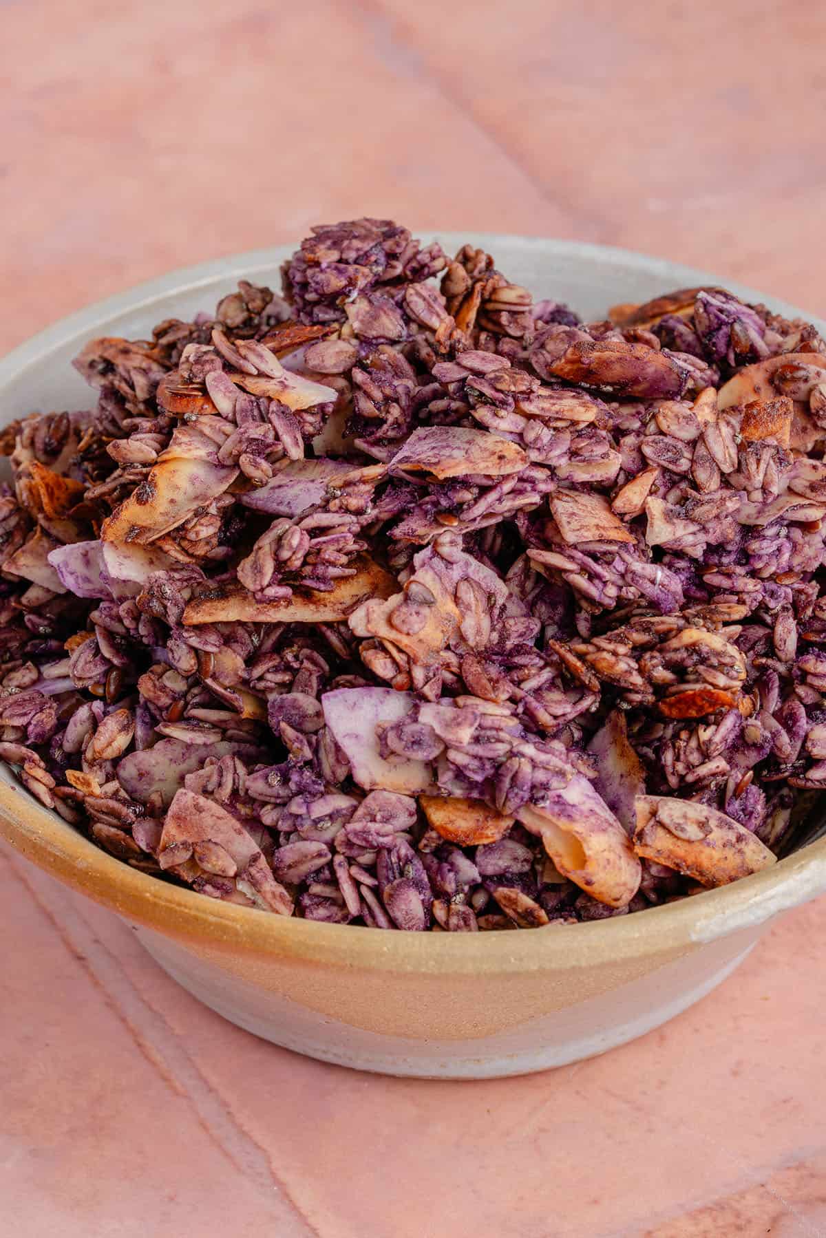 Bowl filled with crunchy Ube Coconut Granola