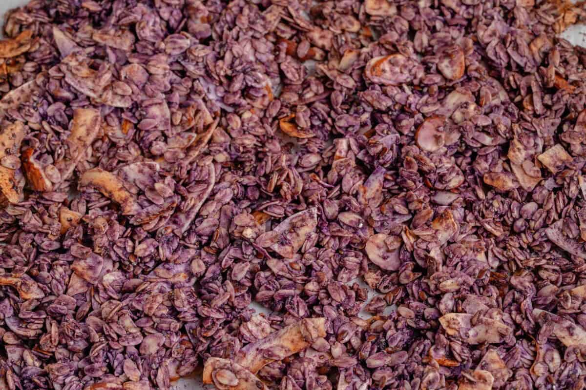 horizontal photo of crispy toasted Ube Coconut Granola on baking