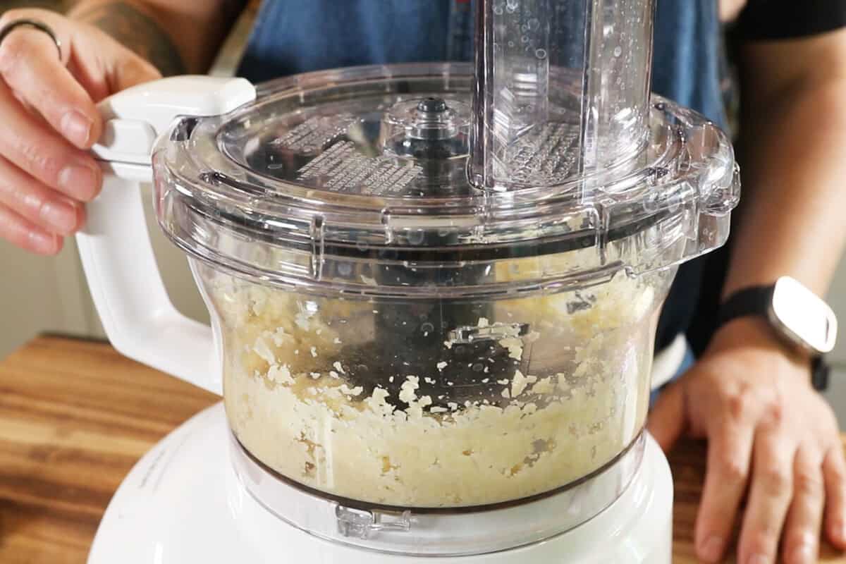 chopping garlic and salt for Lebanese Garlic Sauce (Toum) in food processor