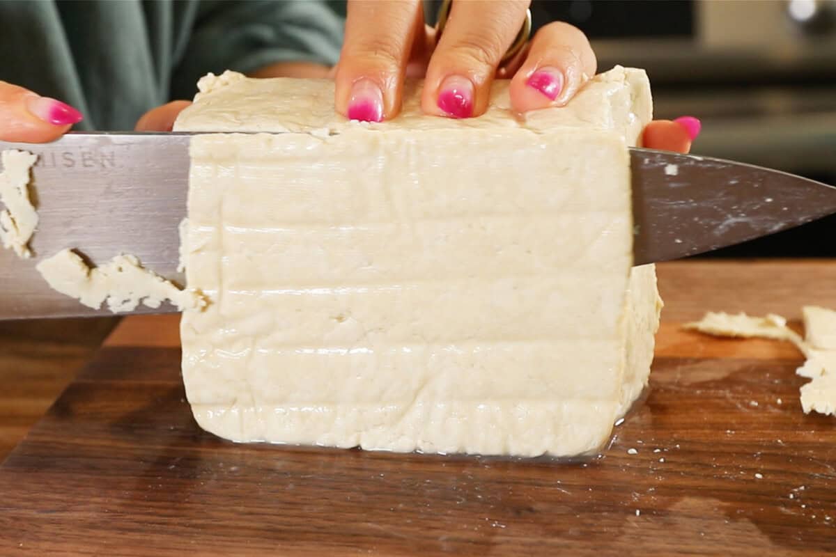 thinly slicing tofu into sheets