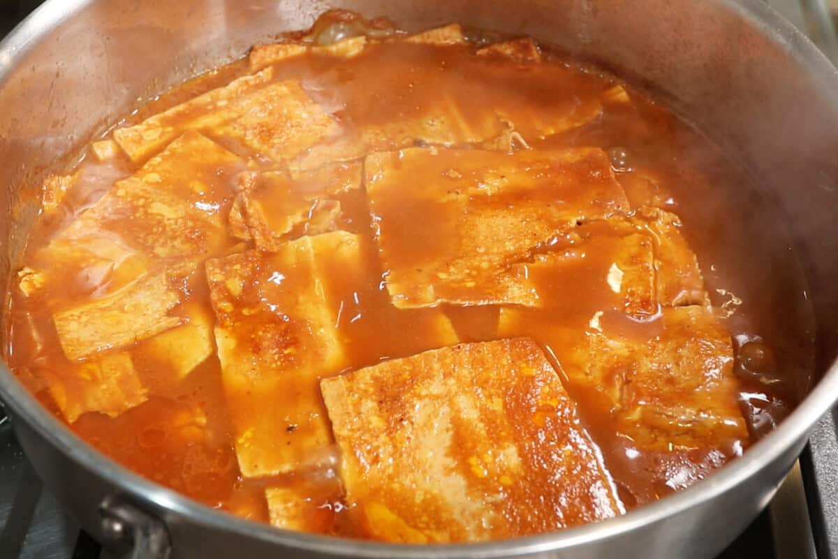 thinly sliced tofu sheets and marinade for Ham-Style Tofu Deli Meat Slices in large pot