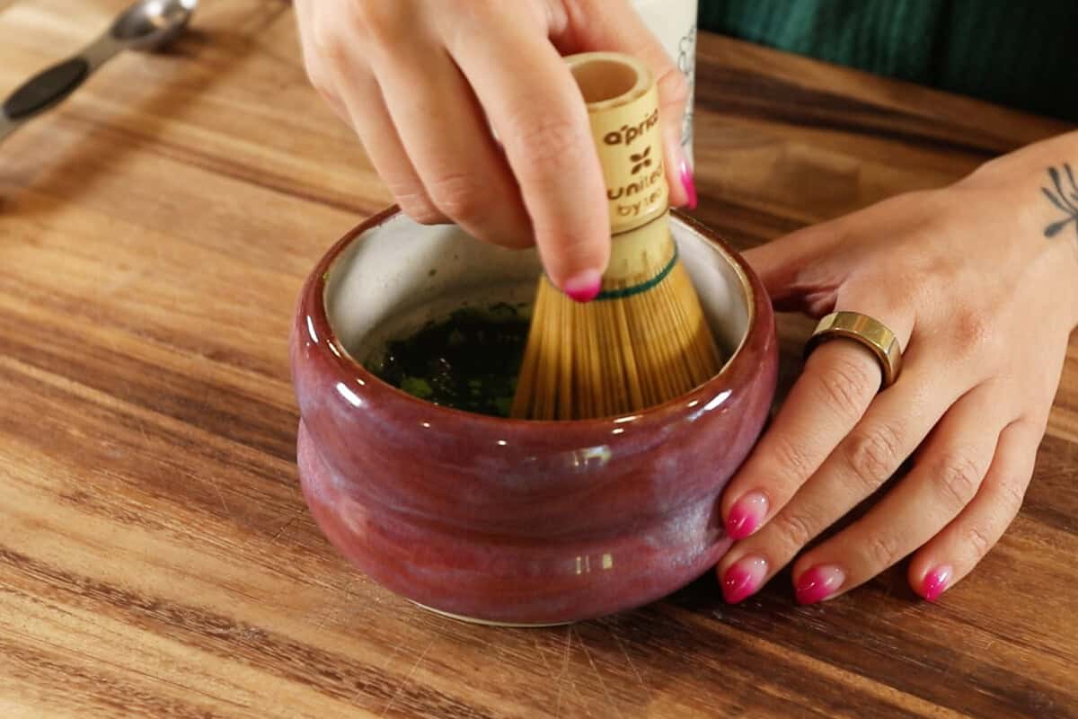 whisking matcha