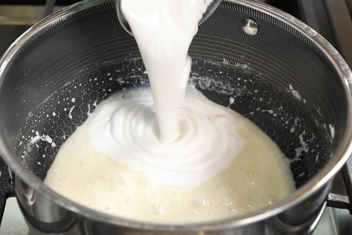 pouring coconut milk into pot for Vegan Matcha Crème Brûlée