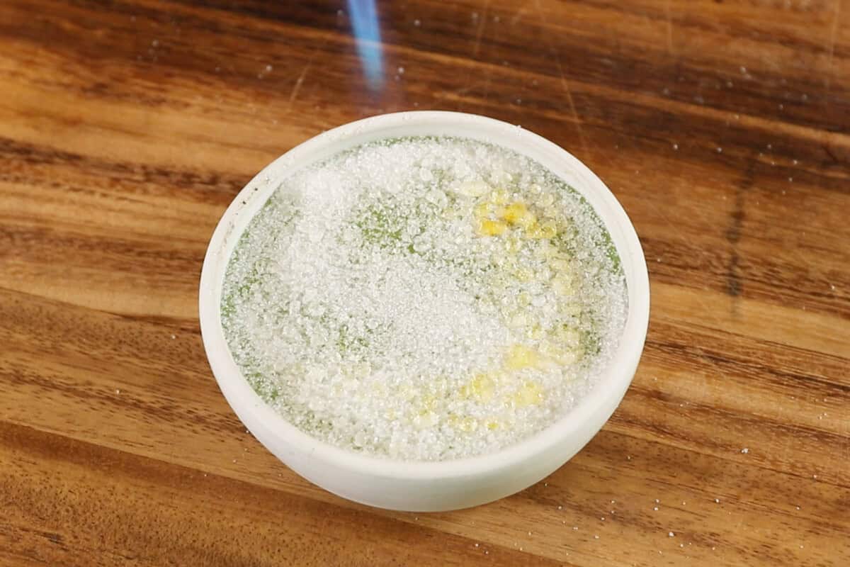 torching sugar on top of matcha custard in ramekin for Vegan Matcha Crème Brûlée