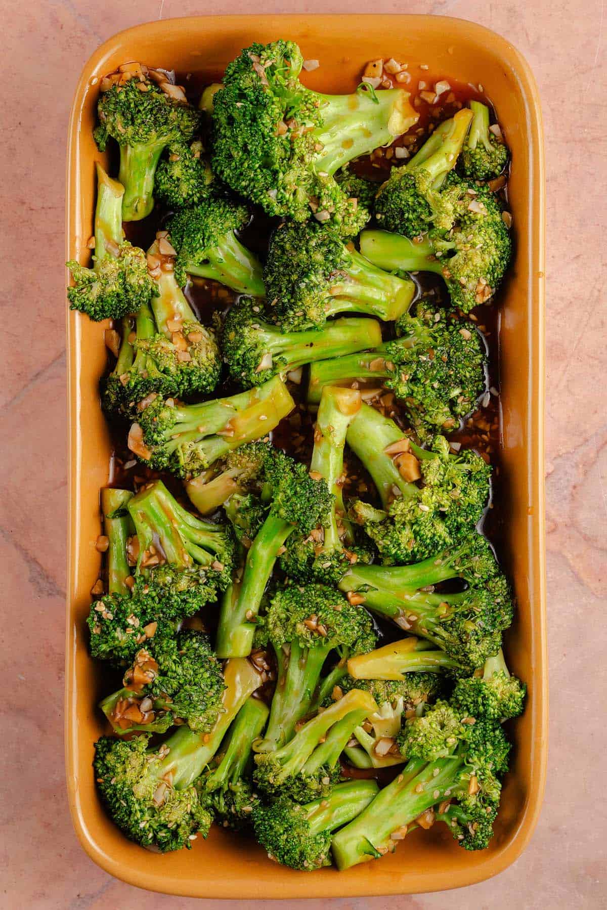 overhead photo of 10-Minute Broccoli with Garlic Sauce in yellow dish