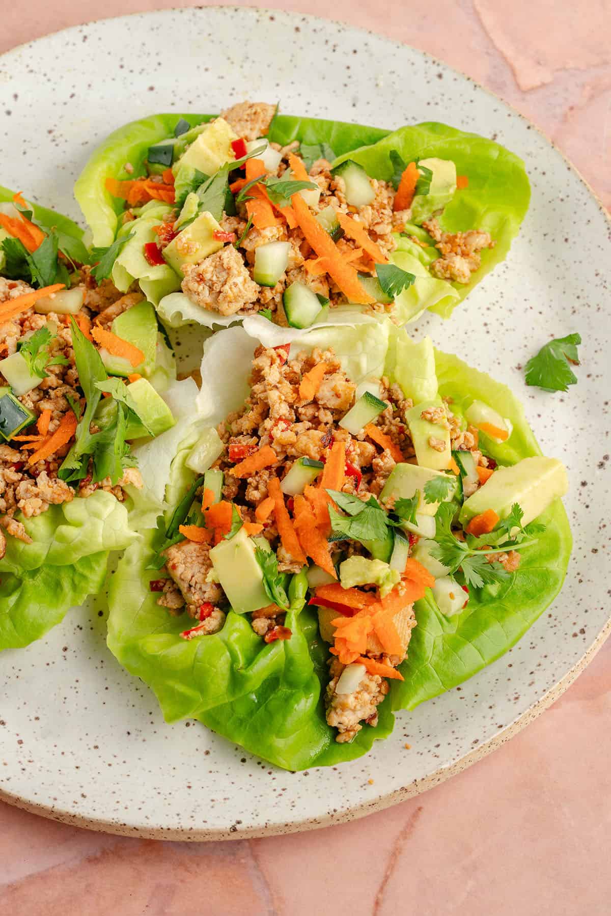 3 chili lime tofu lettuce wraps on a plate
