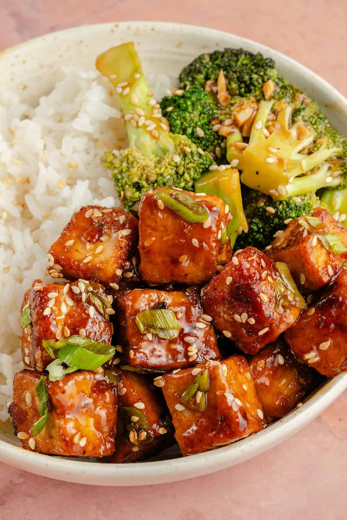 overhead image of a bowl filled with maple glazed tofu, broccoli, and rice