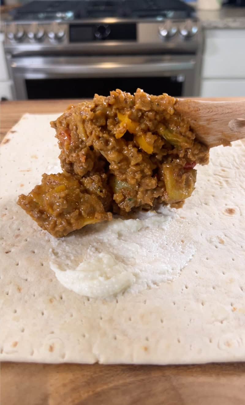 adding filling to wrap