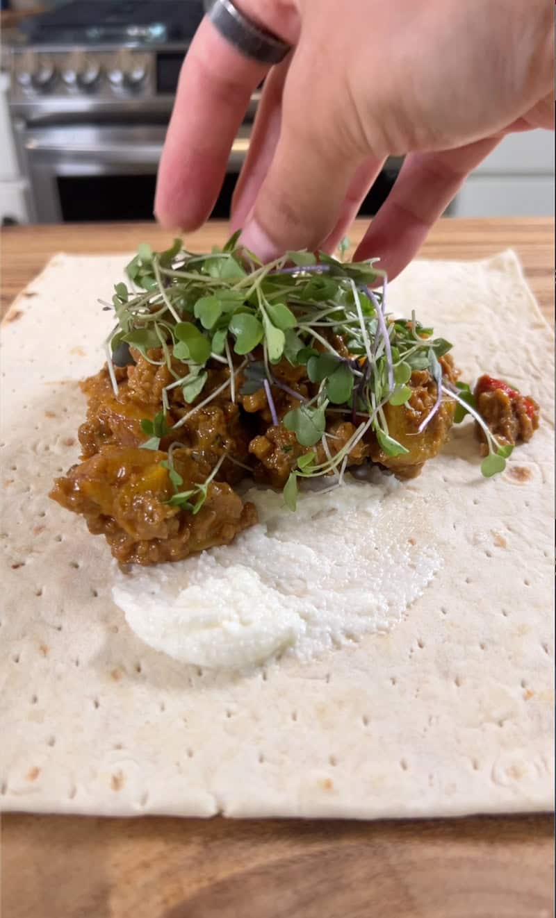 adding micro greens to wrap