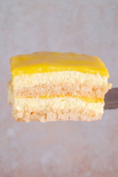 a slice of vegan limoncello tiramisu on a spatula