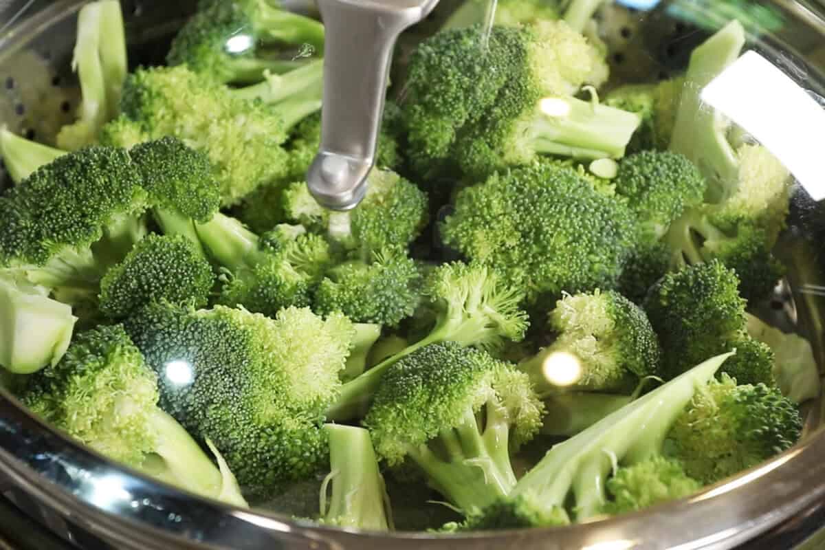 raw broccoli in steamer