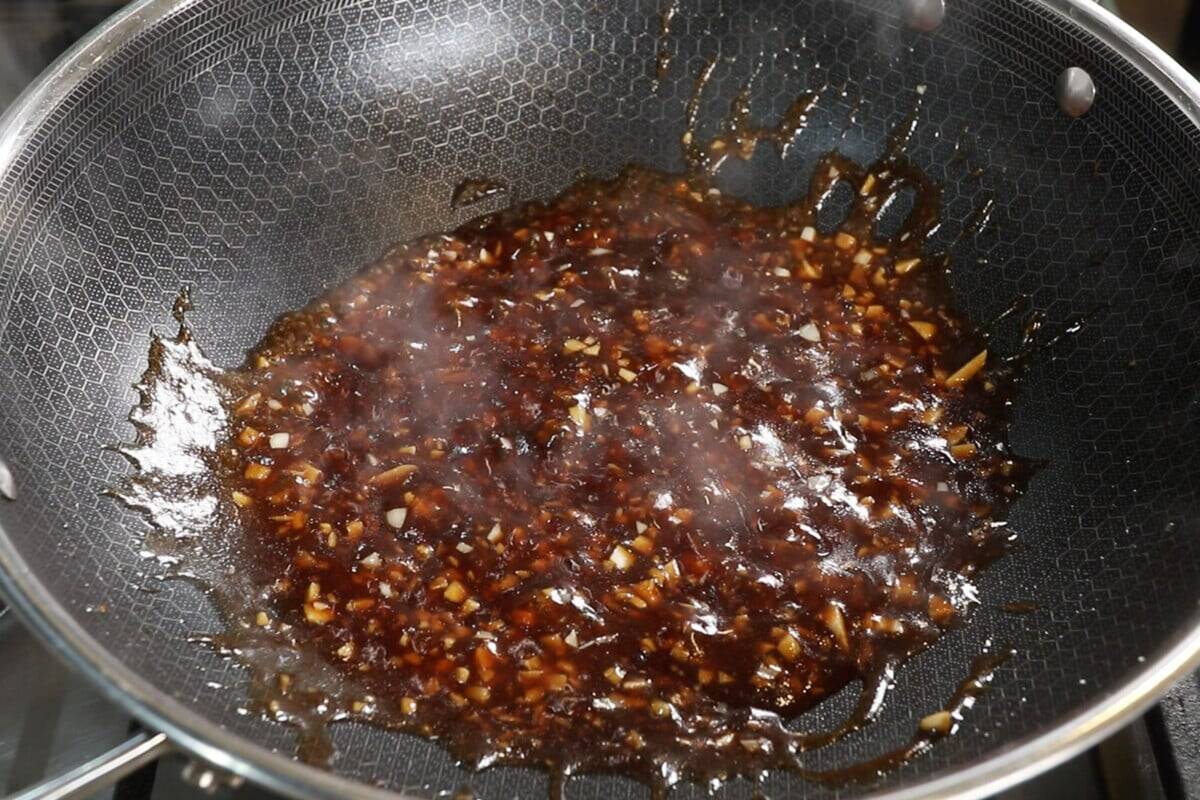 large wok with sticky Garlic Sauce