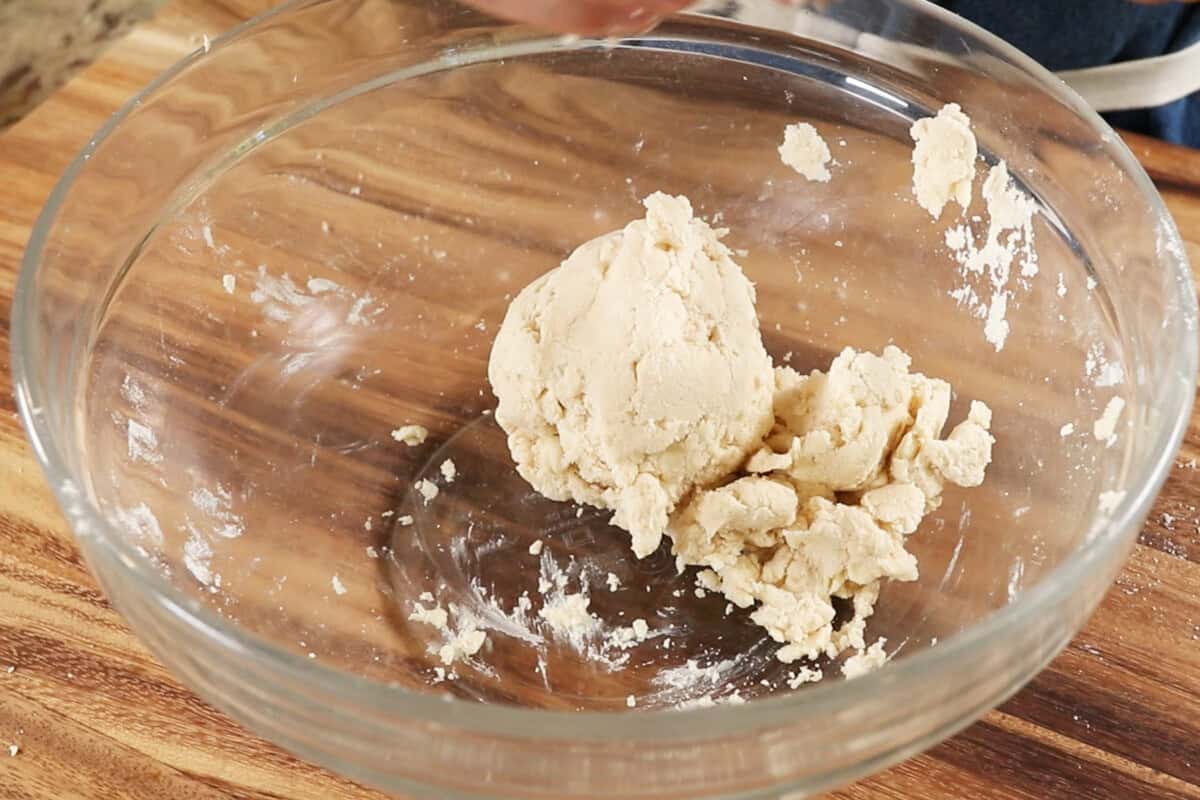 homemade pie crust dough in large glass bowl