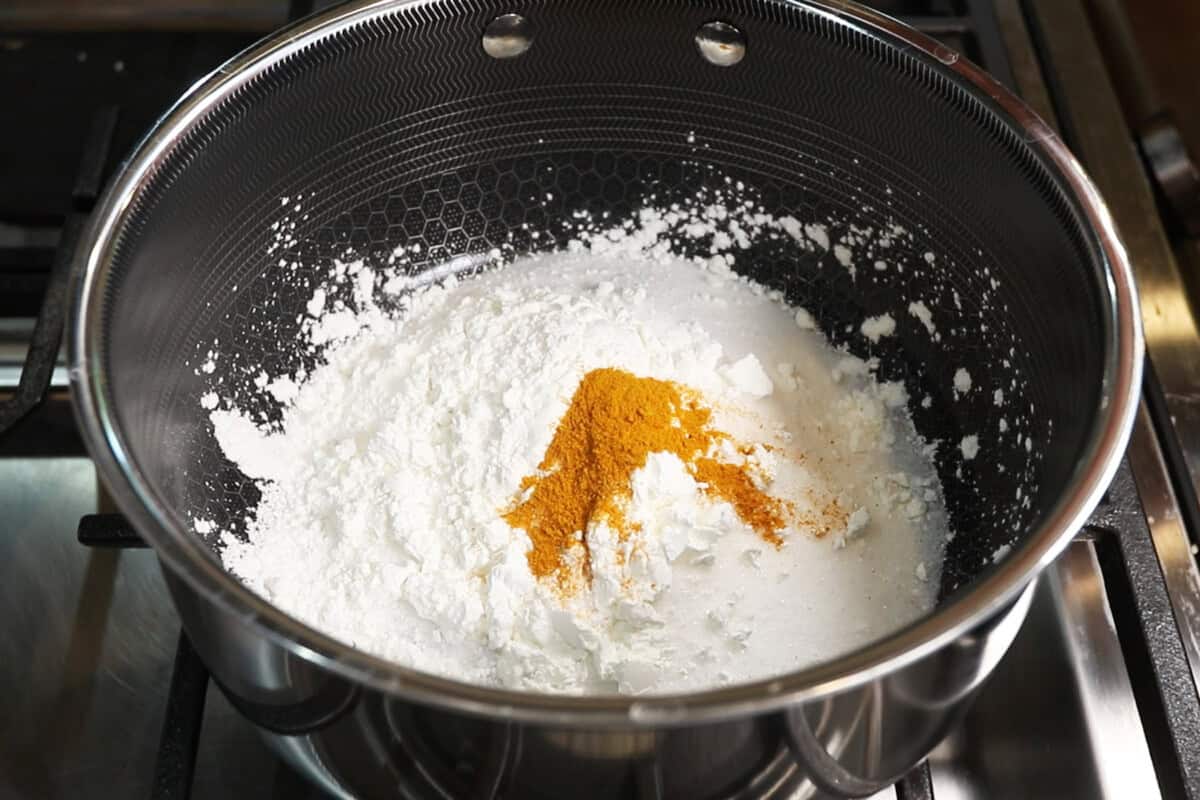 preparing lemon curd filling in small pot for Classic Vegan Lemon Meringue Pie