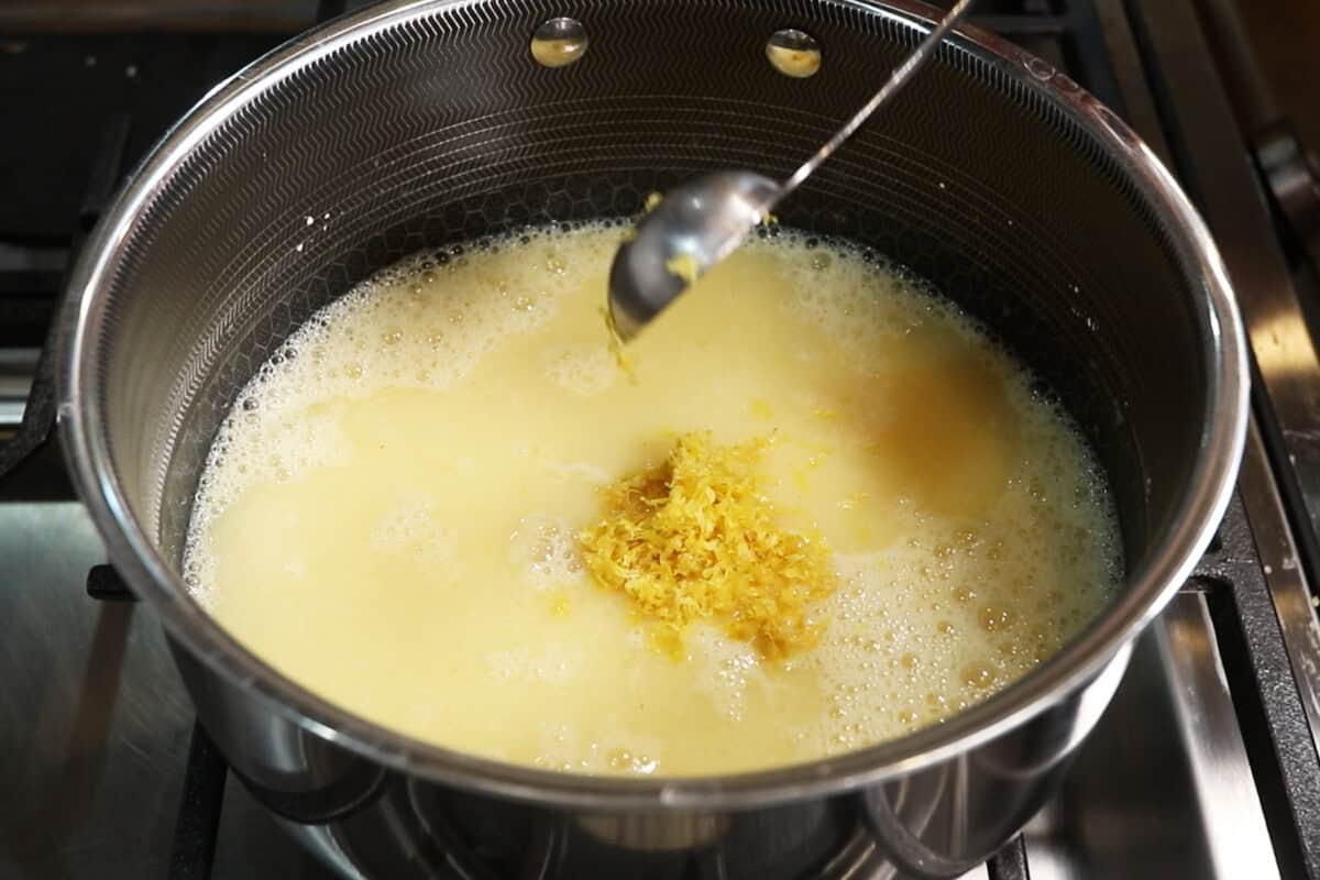 preparing lemon curd filling in small pot for Classic Vegan Lemon Meringue Pie