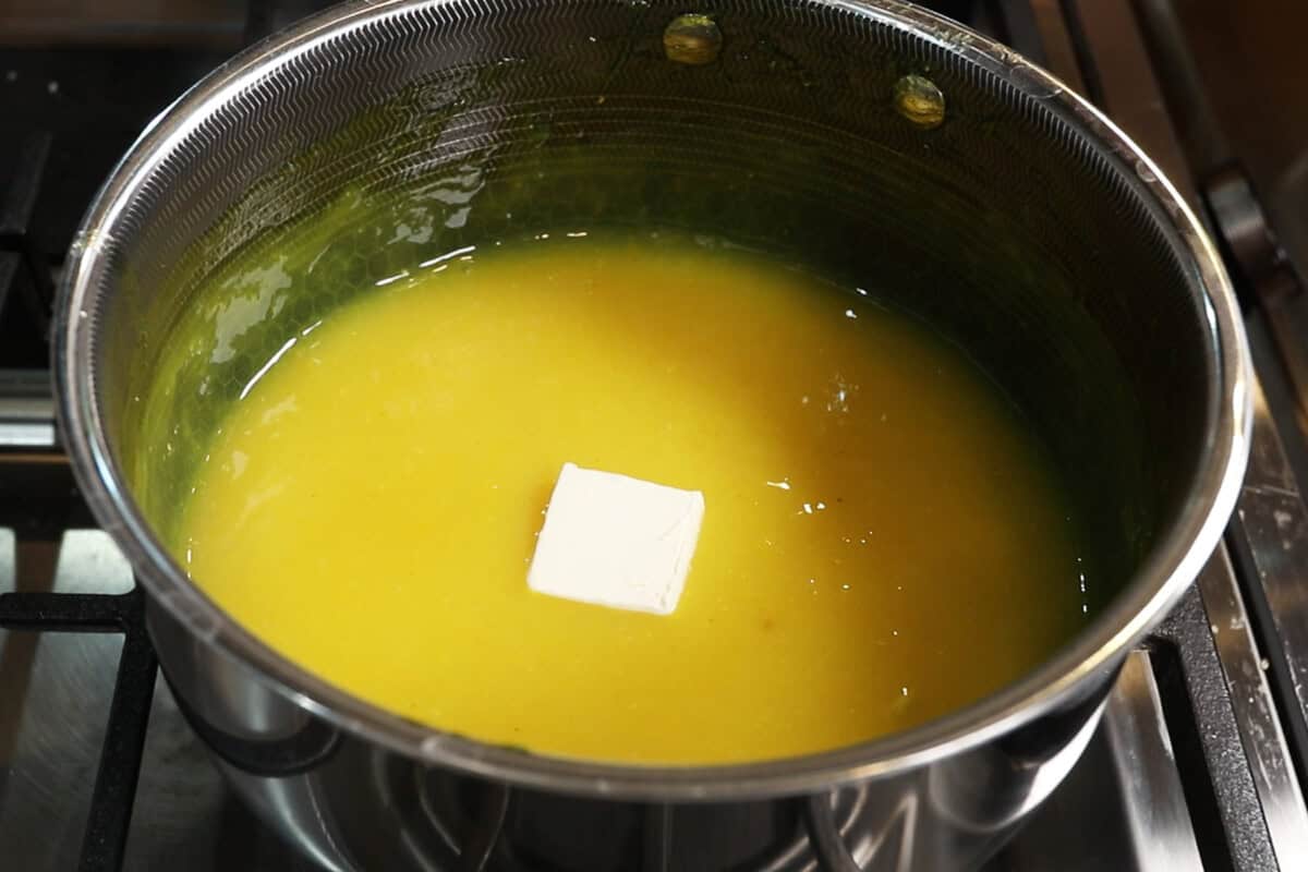 preparing lemon curd filling in small pot for Classic Vegan Lemon Meringue Pie