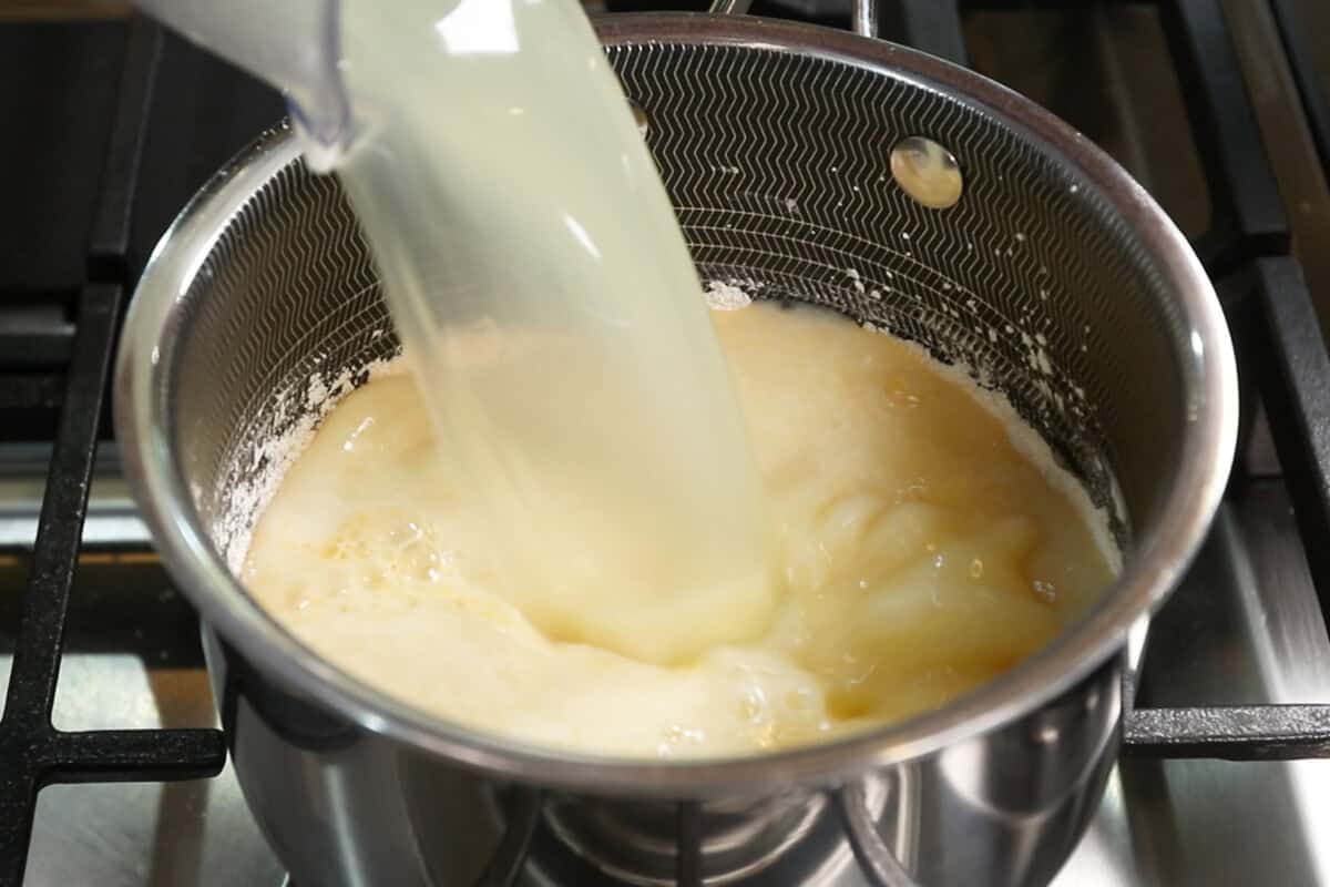 adding lemon juice to a saucepan