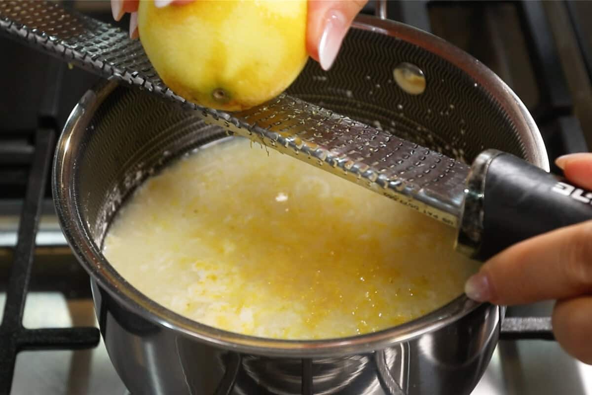 zesting lemon into saucepan