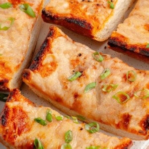 sliced cheesy gochujang garlic bread on a plate